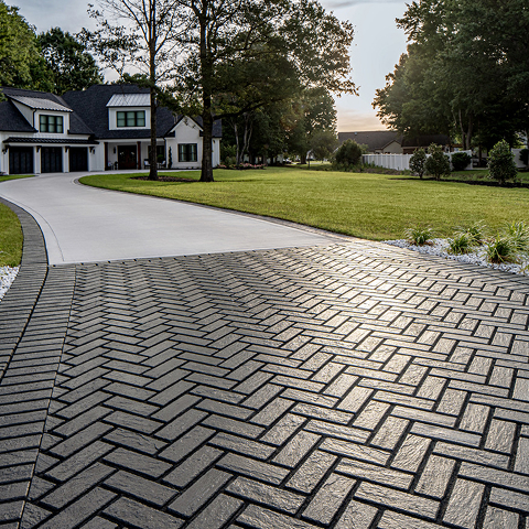 Mika Pavers in a diagonal pattern with a textured concrete look, offering a reclaimed brick style for permeable driveways.