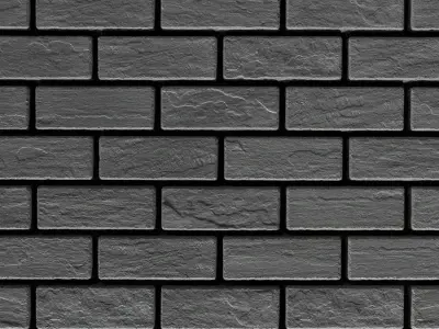 Gros plan sur les pavés Mika de Techo-Bloc montrant un motif linéaire sombre avec une texture lisse rappelant l’ardoise.