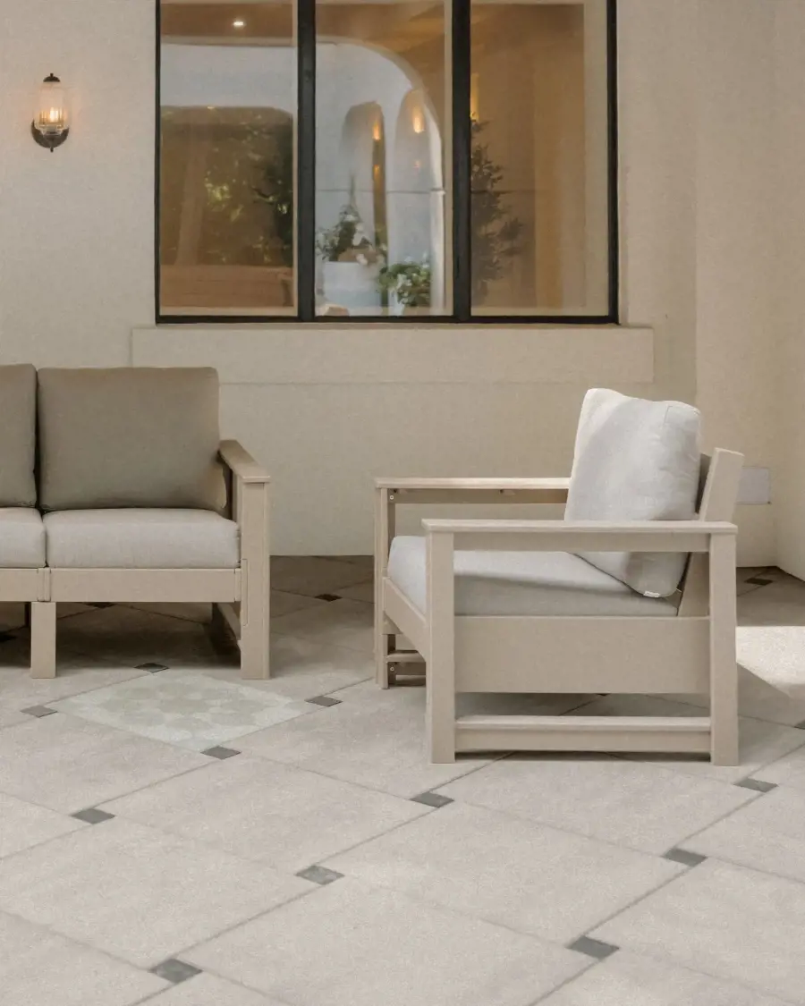 Garden walkway designed with Industria 600×600 slabs in Caffè Crema, where subtle contrast and light create a calm, refined outdoor experience.