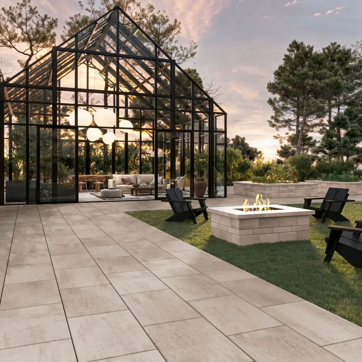 Industria 900x600 Paver by Techo-Bloc in beige, linear patio with glass greenhouse and fire pit surrounded by black chairs.