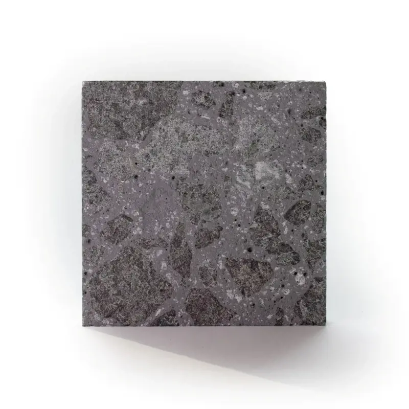 Terrazzo Sample patio slab in Meteor Black with bold aggregate texture and deep charcoal tones