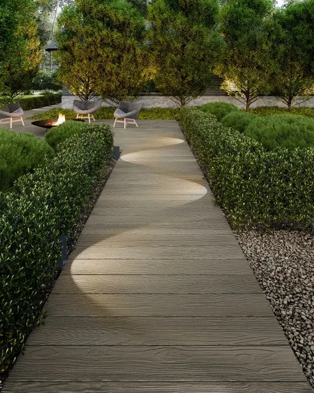 Patio paisible avec foyer central et haies arrondies—parfait pour les projets admissibles au programme de financement Pave Now, Pay Later.