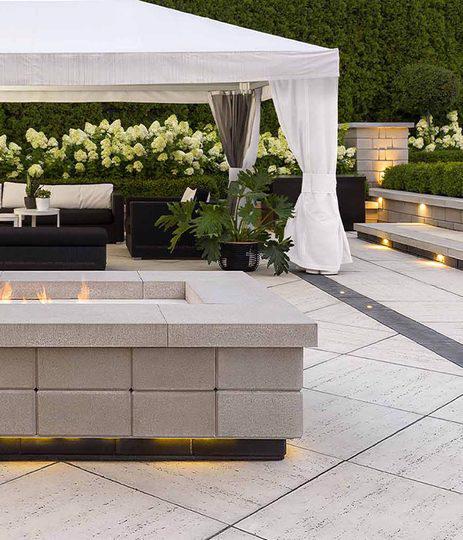 Techo Bloc slabs walls backyard patio firepit lighting travertina raffinato ivory beige cream