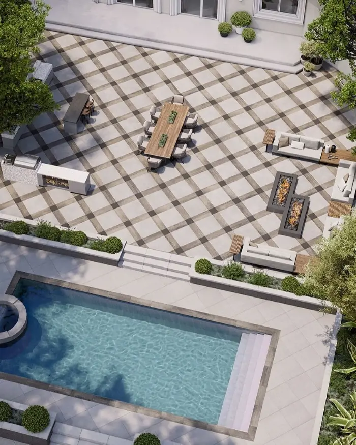 Pool deck with Techo-Bloc Industria 900 & 300 slabs in alternating sizes for modern design.