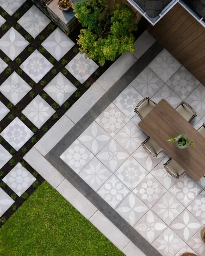 Overhead view of Techo-Bloc Industria Flora pavers in geometric pattern beside outdoor seating