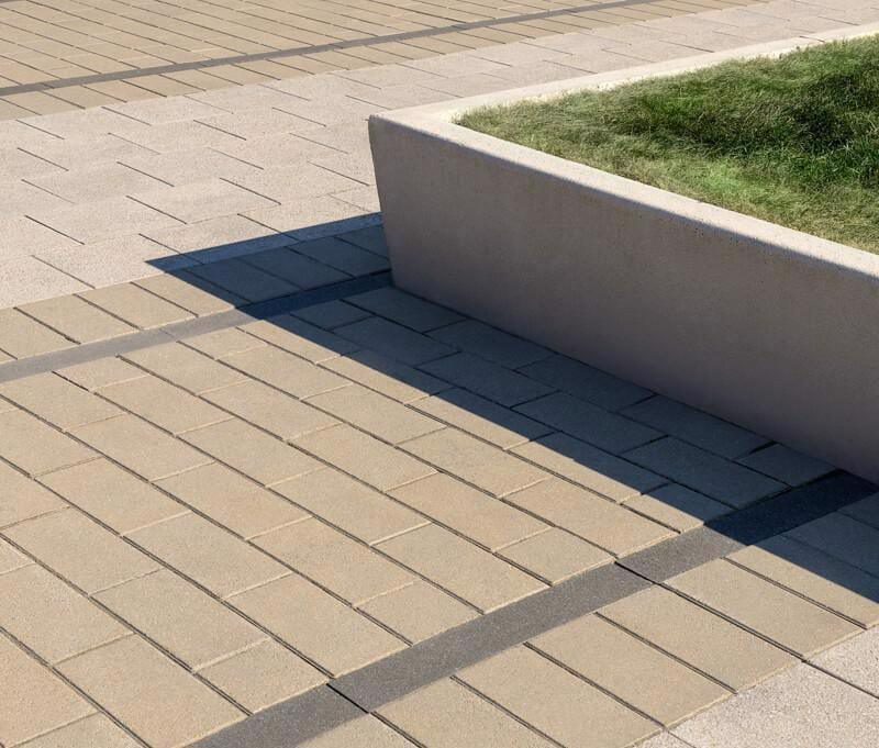 Close up of courtyard floor featuring Techo-Bloc Industria Granitex Paver.
