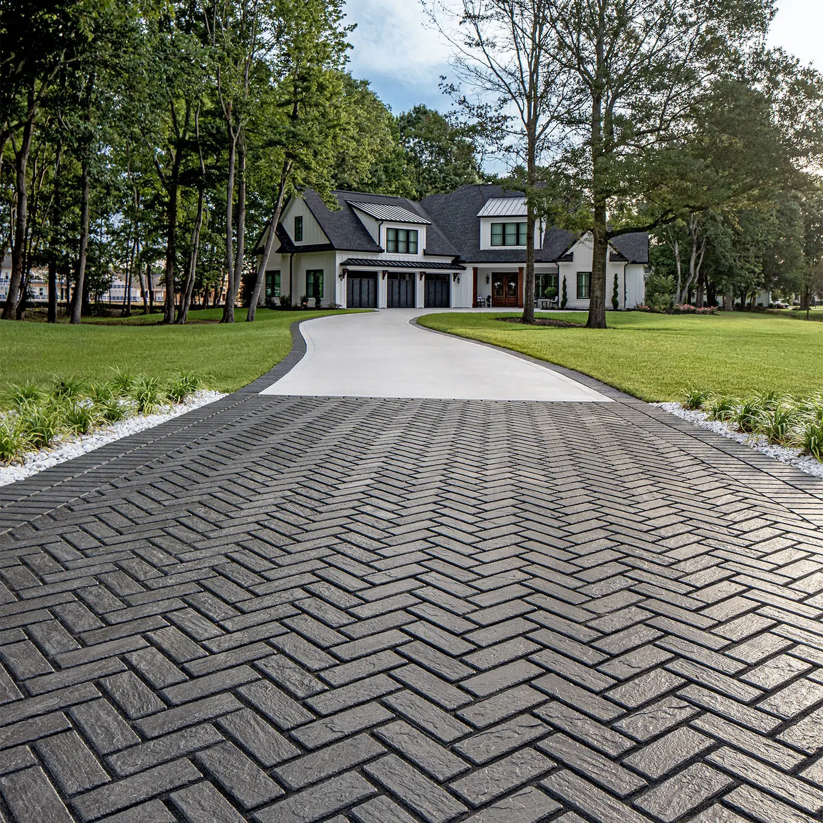 Mika Paver in Onyx Black driveway laid in a herringbone pattern