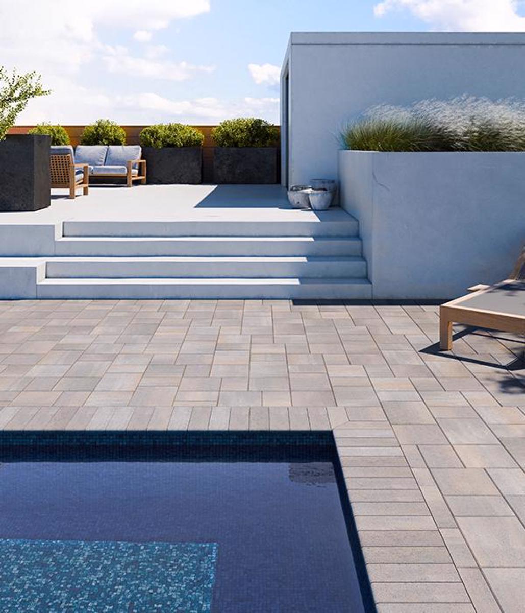 Techo bloc backyard patio poolside overlay slabs caps champlain grey pacific 600x700