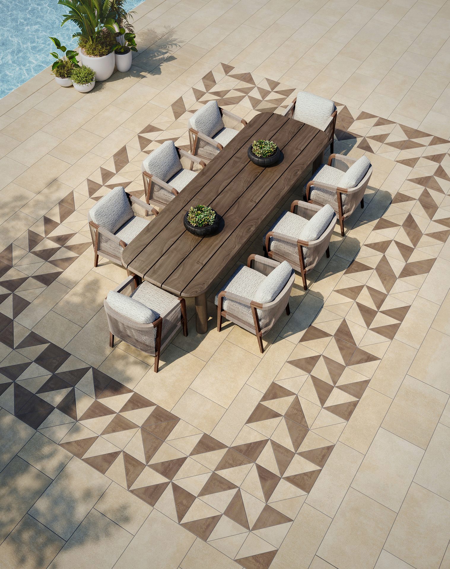 Areal view of a dining area with a triangular mosaic design in the patio.