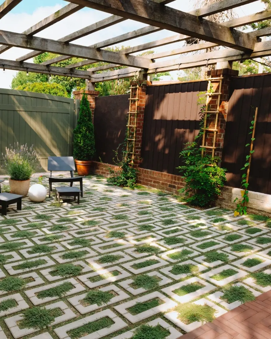 Intimate outdoor courtyard featuring permeable Westmount pavers in Merlot, demonstrating how compact spaces can remain adaptable, sustainable, and visually cohesive.