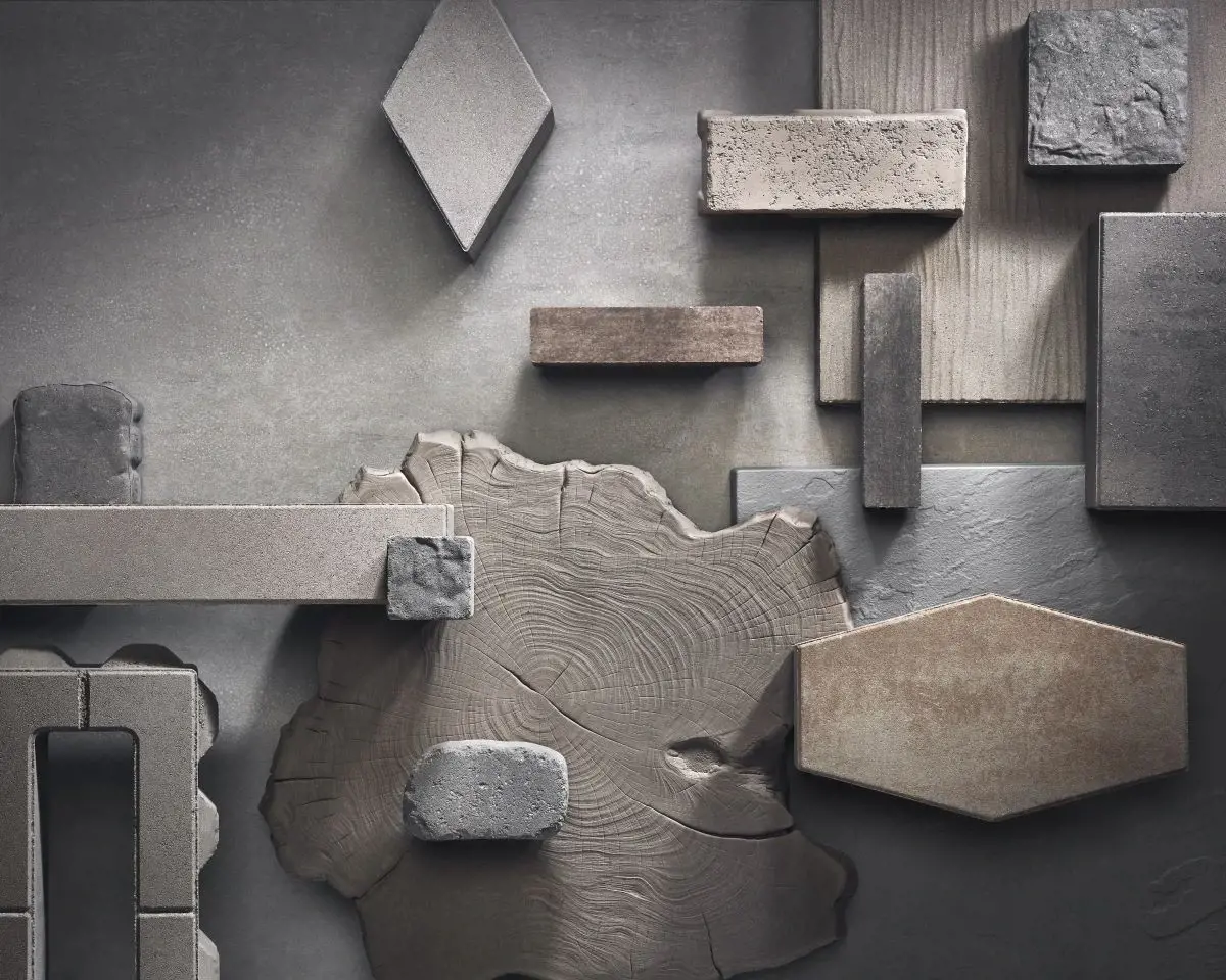 Agencement artistique d’échantillons de pavés et dalles aux formes, textures et finis variés—illustrant la couleur, l’échelle et la créativité pour l’aménagement extérieur.