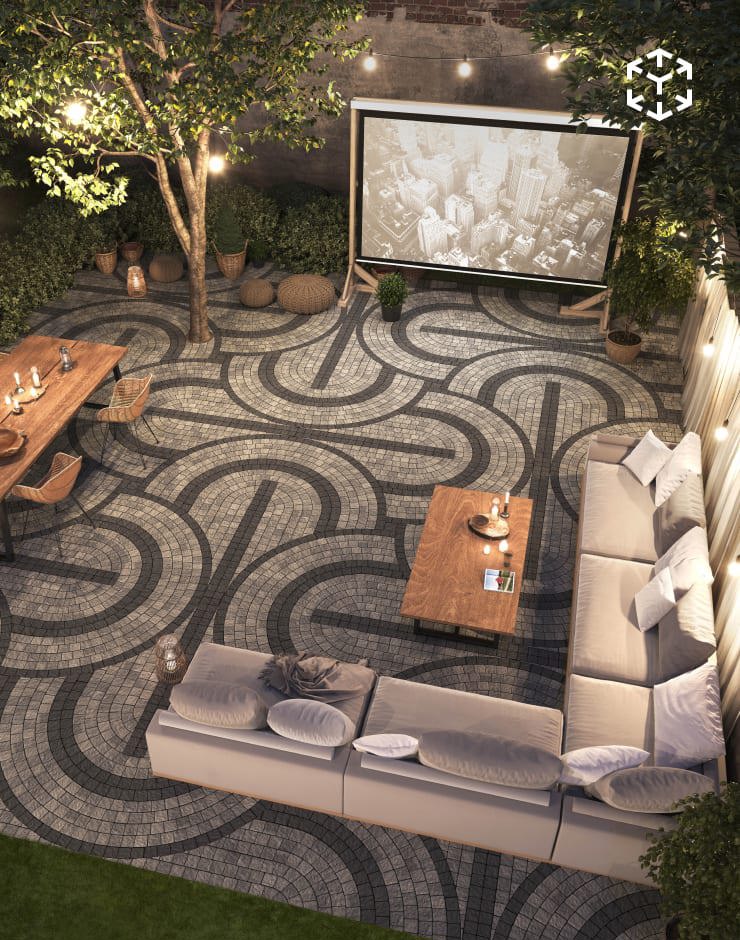 Squadra Arches mosaic pattern creating curved paver designs in an outdoor lounge area with seating and ambient lighting.