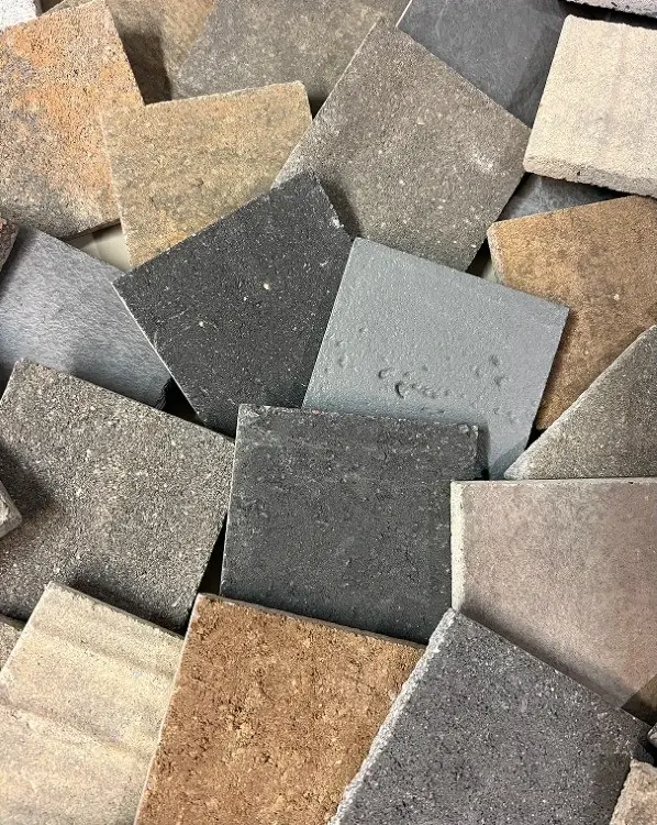 Variety of Techo-Bloc paving stone samples in assorted colors and textures.