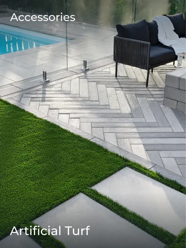 Contemporary outdoor space combining synthetic grass and large format pavers to create a clean, low-maintenance pathway.