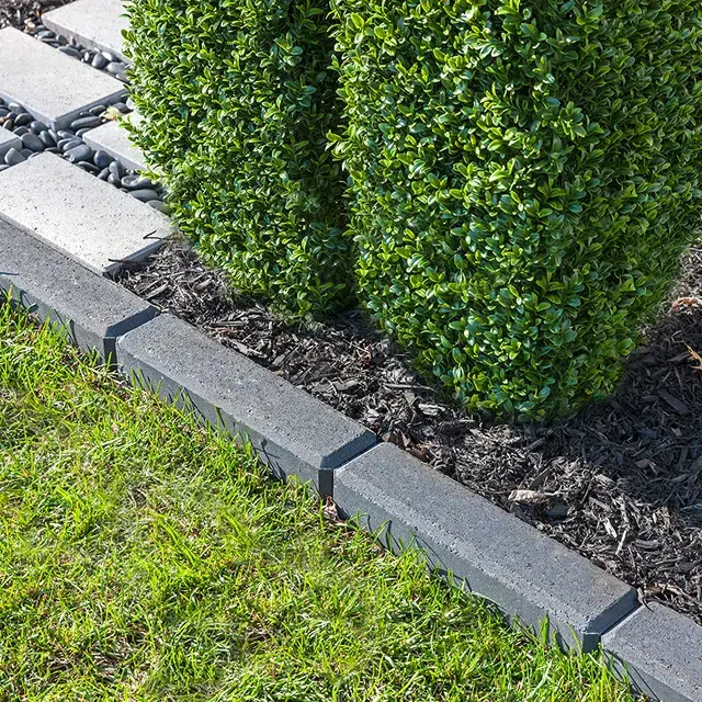 Raffinato Smooth by Techo-Bloc, modern smooth concrete edging stones, providing sleek and clean borders for garden beds and driveways.