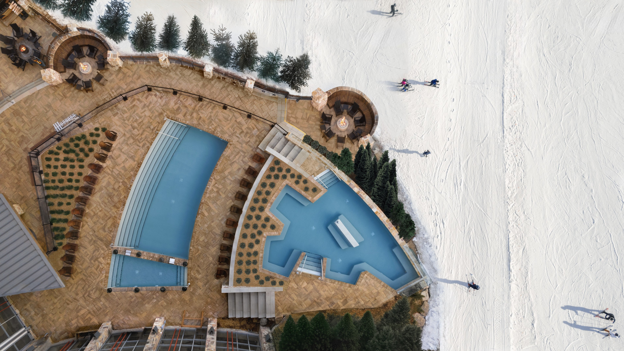 Vue aérienne du Fairmont Tremblant avec dalles Everest HD² Ardoise Brun Châtaigne de Techo-Bloc autour des piscines et terrasses.
