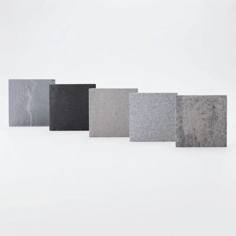 Grey paver sample box featuring modern stone finishes in cool tones