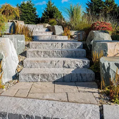 Rocka Step by Techo-Bloc, large pre-cut stone steps with a natural look, perfect for creating rustic outdoor staircases and pathways.