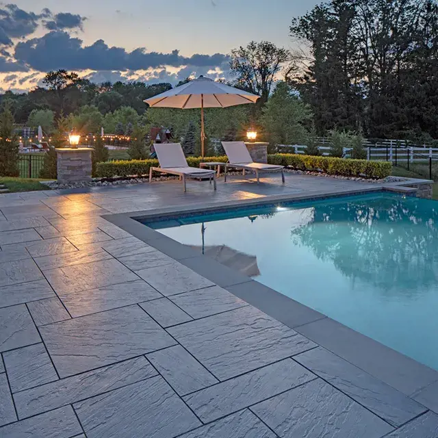 Aberdeen Slabs in a sleek, linear pattern, providing a smooth, modern patio surface with Klean-Bloc protection for long-lasting beauty.