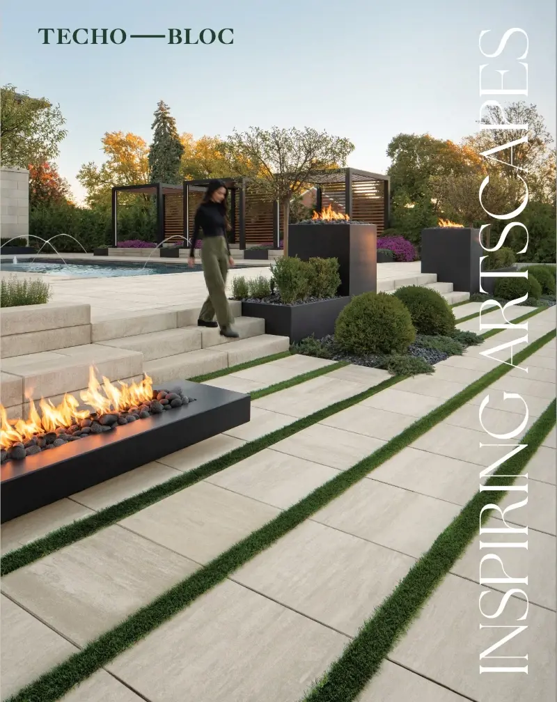 Modern patio with linear stone slabs and fire feature, featured on the Techo-Bloc landscape catalog cover.