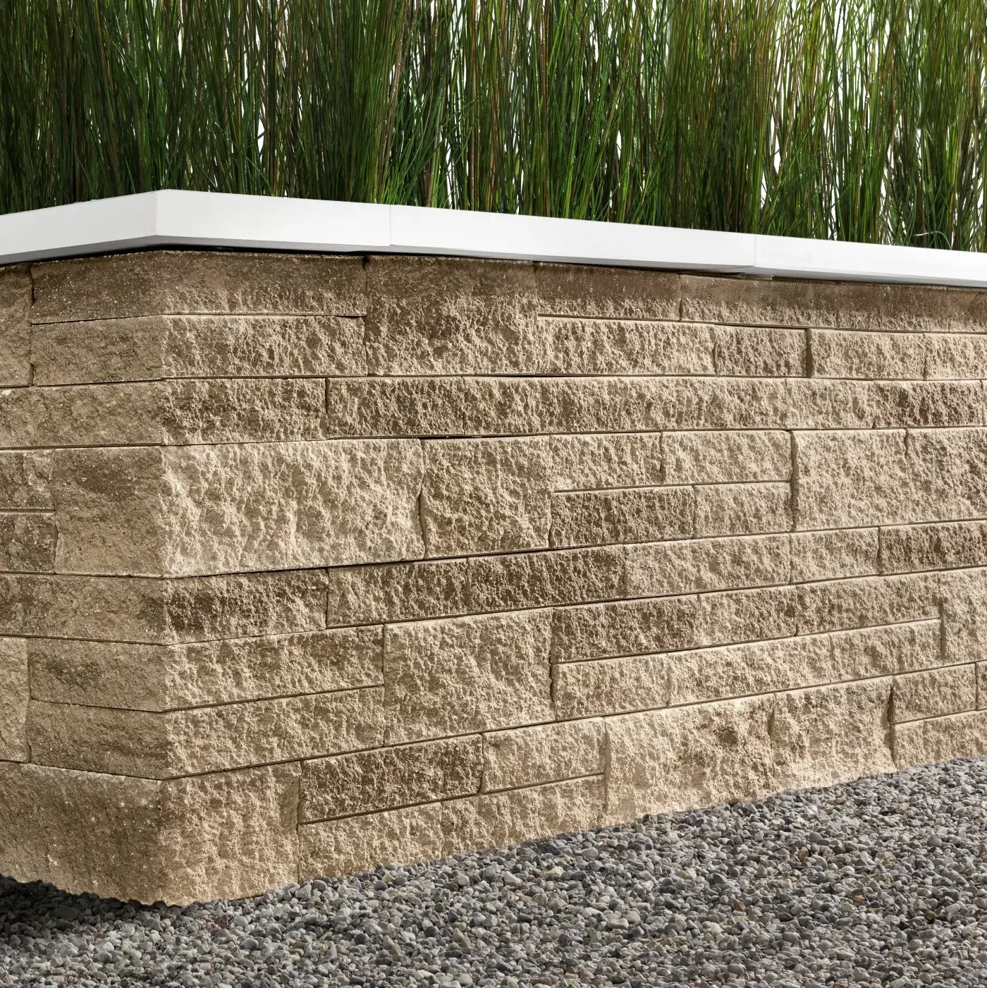 Mini-Creta Architectural retaining wall in Caffè Crema, featuring a refined textured finish and clean modern cap