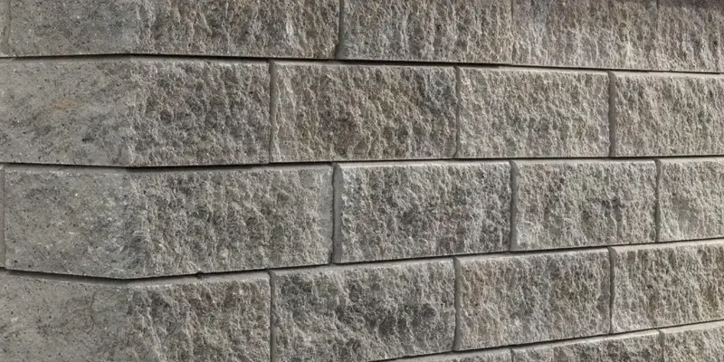Semma Wall split-face retaining wall texture in warm grey tones 