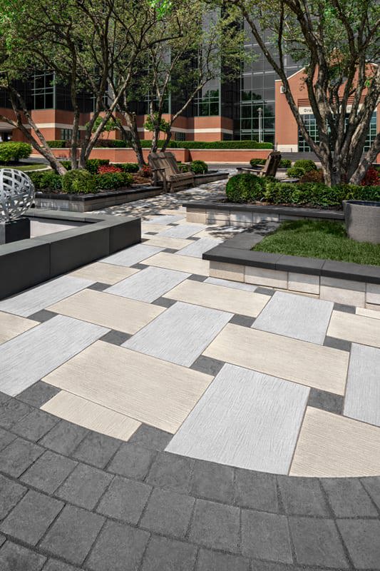 Office Courtyard designed with Techo-Bloc's Ocean Grande Slab and Valet Paver.