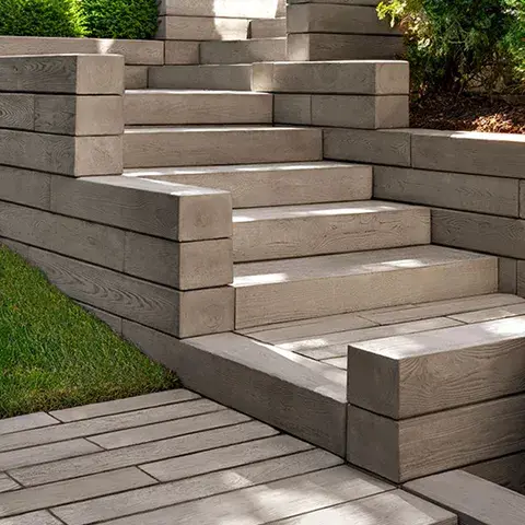 Borealis Step by Techo-Bloc, wood-like concrete steps that offer a durable, warp-resistant solution for creating outdoor staircases.