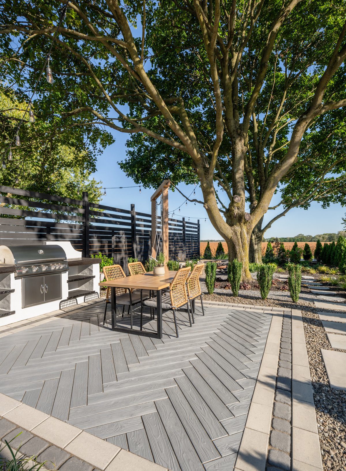Road surface, Outdoor furniture, Urban design, Plant, Table, Wood, Shade, Tree, Chair