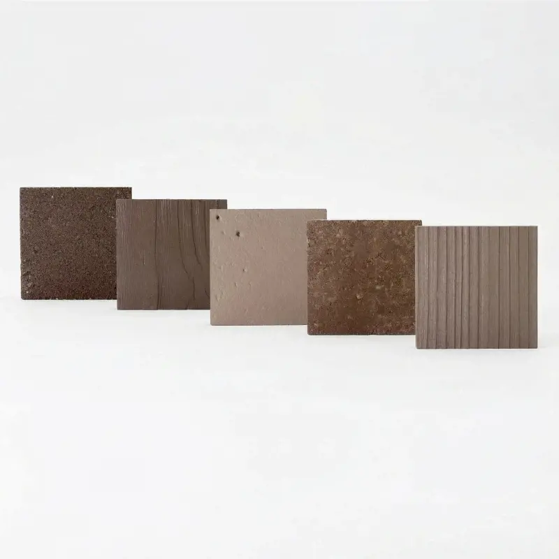 Brown paver sample box with warm natural stone colors and textures