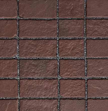 Vue rapprochée des pavés Saint-Oxford en rouge foncé, joints marqués et agencement régulier.