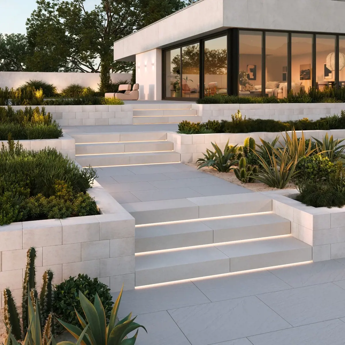 Mur Systema par Techo-Bloc en Nickel Grisé, utilisé pour des terrasses modernes avec marches éclairées intégrées.