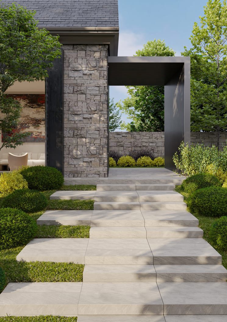 Walkway outside of a house featuring natural stone steps.