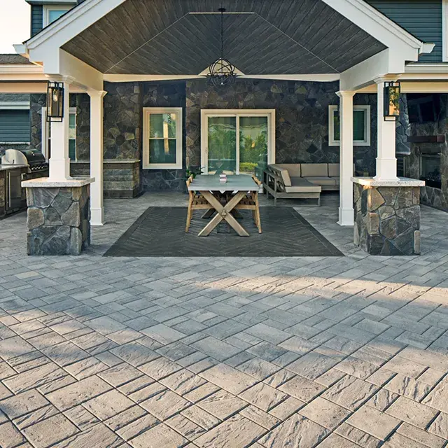 Eva Slate Pavers by Techo-Bloc with slate texture, creating a budget-friendly and stylish patio with a smooth, elegant finish.