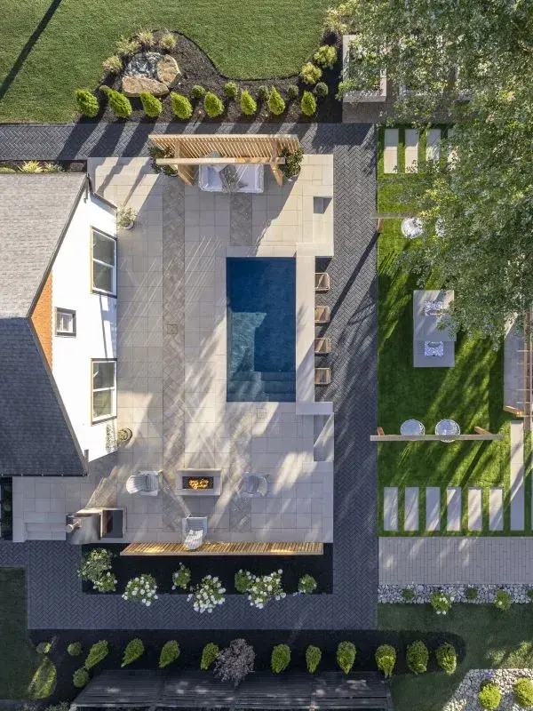 Outdoor wellness retreat with plunge pool and greenery.