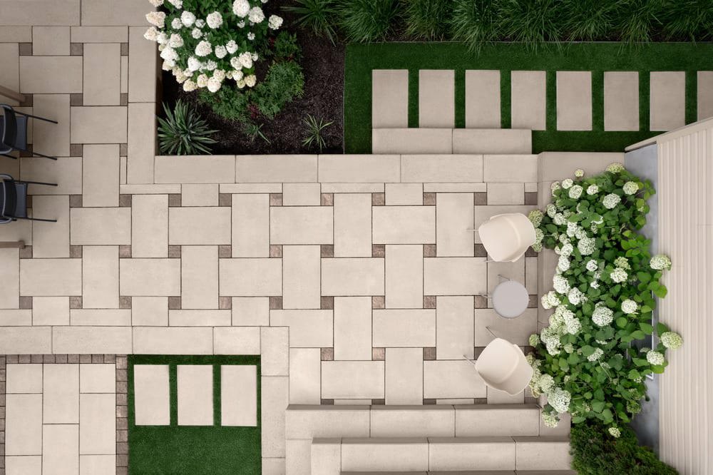 An aerial view of a patio with plants and flowers.
