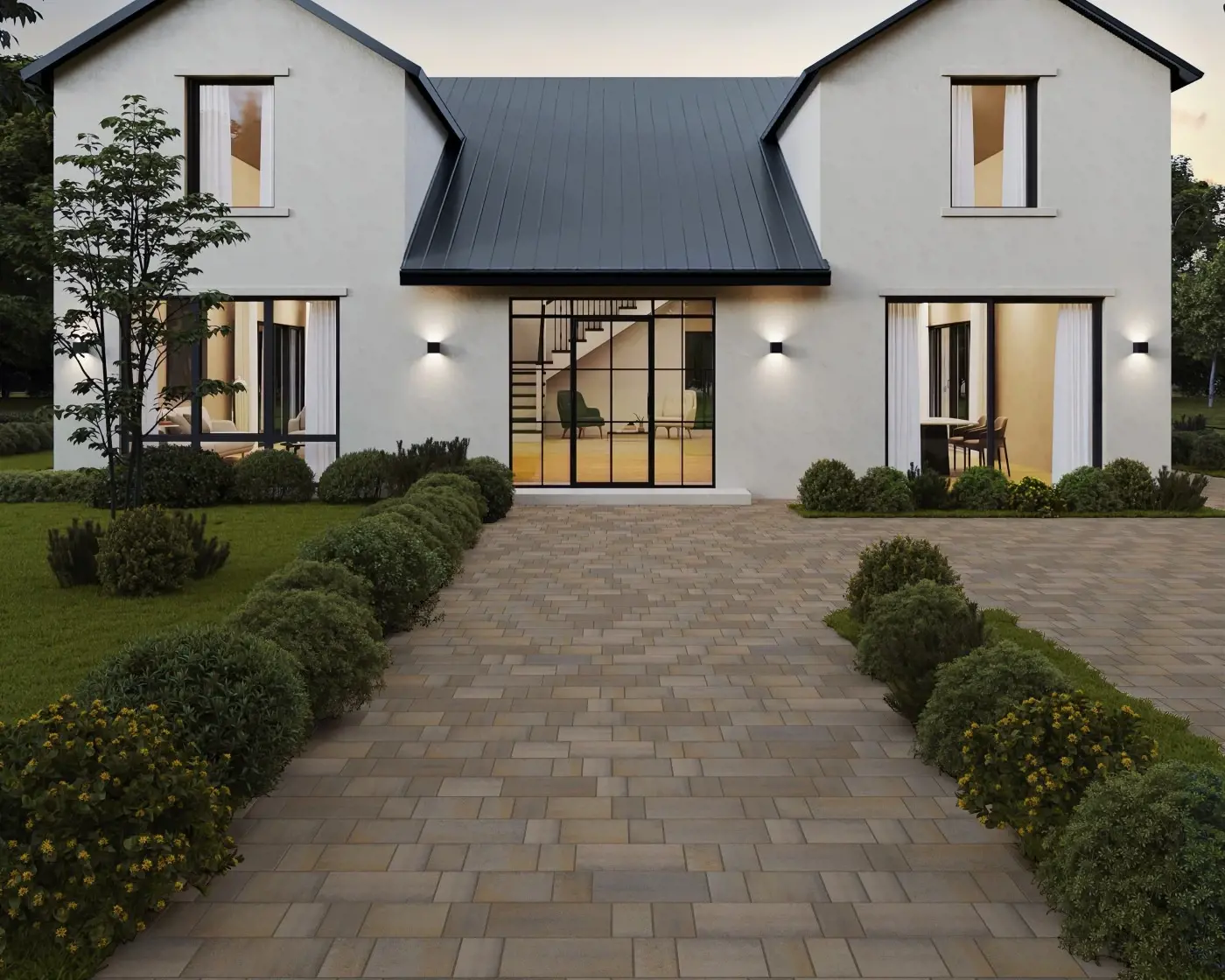 Devanture d’une maison moderne blanche avec une allée pavée de pavés Eva Lisse de Techo-Bloc en Gris Champlain, bordée de verdure et d’un éclairage extérieur élégant.