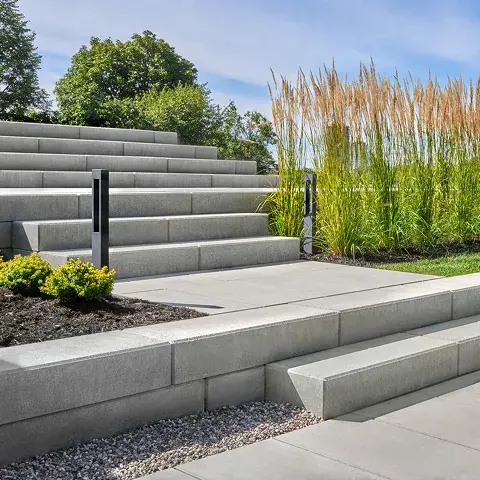 Raffinato Step by Techo-Bloc, modern concrete steps with sleek lines, providing a durable, stain-resistant surface for outdoor staircases.