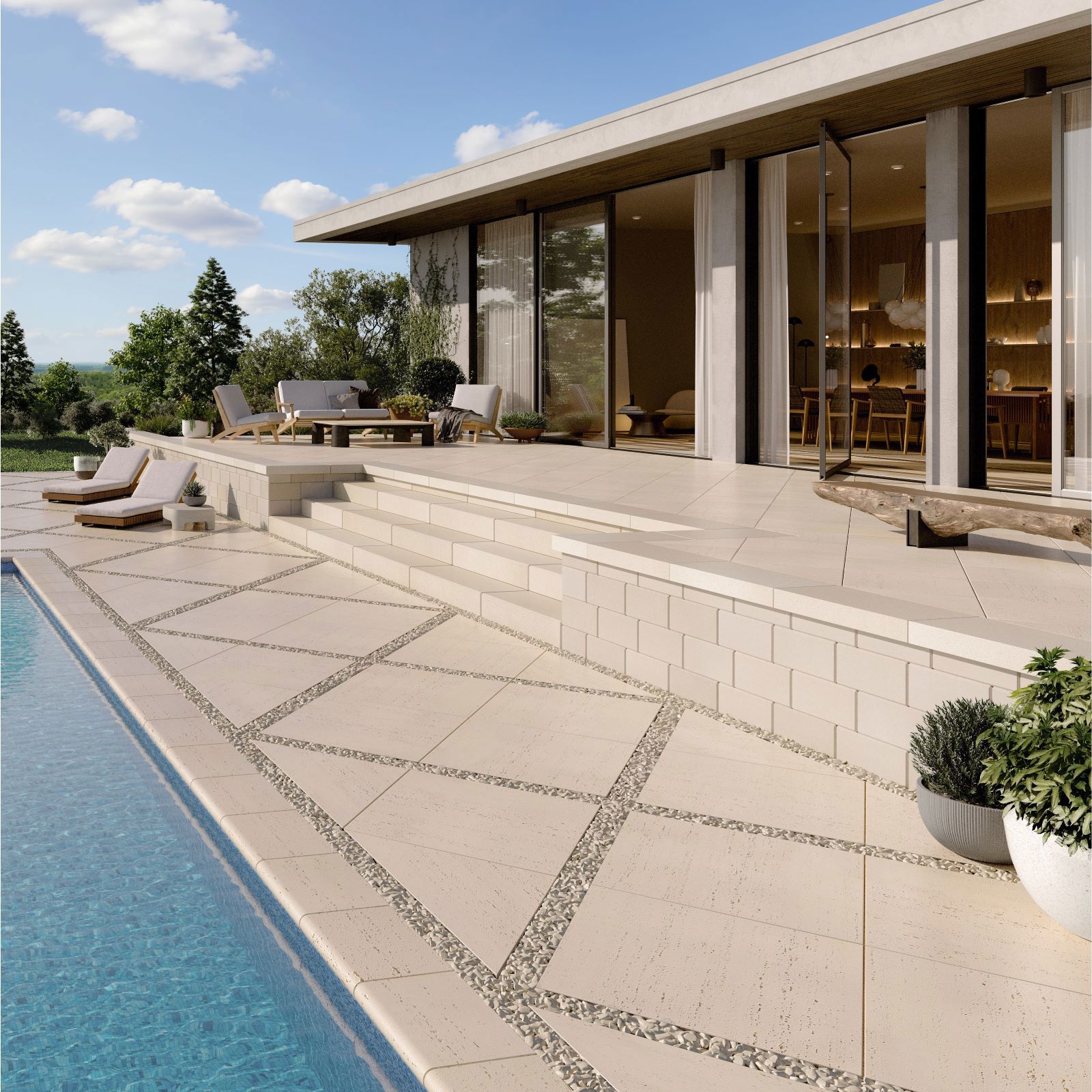 Travertina Raw Slabs by Techo-Bloc in beige, diamond pattern patio beside pool and modern home with glass doors.