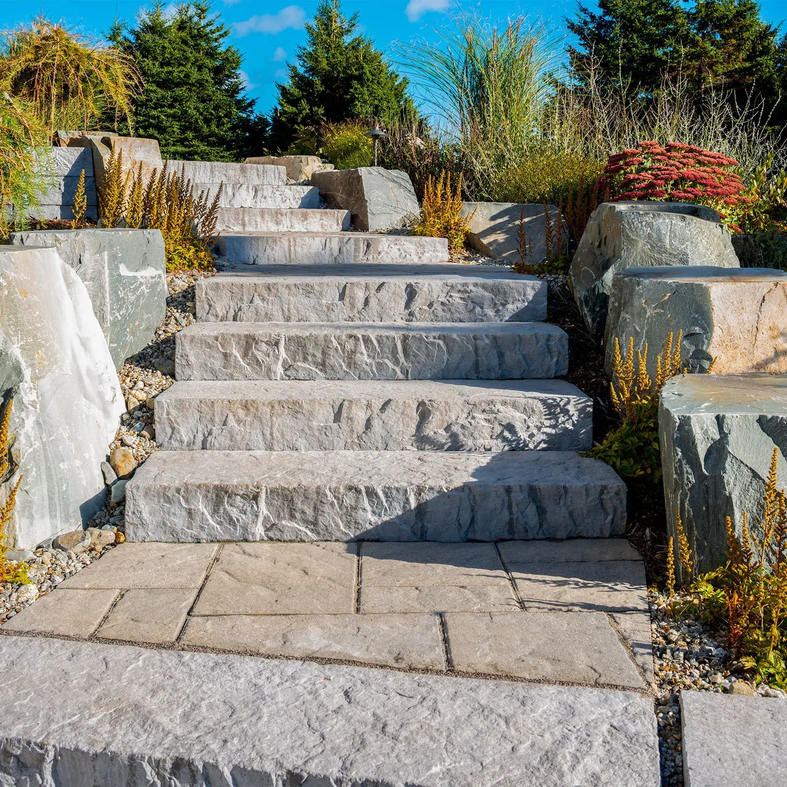 Rocka Step in Riviera forming natural stone stairs with boulders set into a landscaped hillside