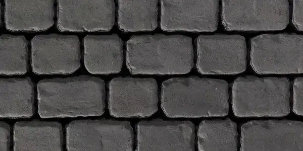Détail des pavés Villagio de Techo-Bloc, aux bords vieillis et texture de pierre ancienne, offrant un style rustique d’inspiration européenne dans des tons foncés et naturels.