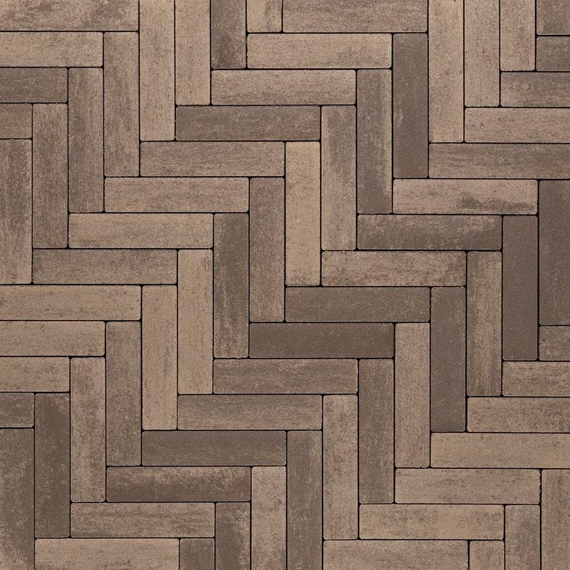 Techo-Bloc Westmount Paver Chestnut Brown with smooth texture, shown in Herringbone Pattern for a warm, interwoven surface design.