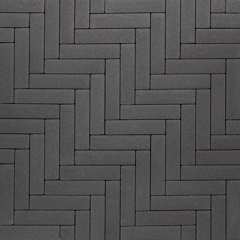 Techo-Bloc Westmount Paver Onyx Black with smooth texture, arranged in Herringbone Pattern for a stylish, modern walkway.
