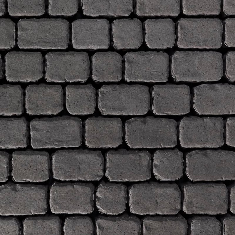 Techo-Bloc Villagio Paver Onyx Black with beveled edges, shown in close-up with a weathered and timeworn appearance.