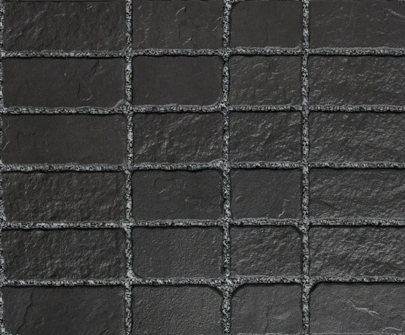 Techo-Bloc Oxford Paver Onyx Black with a textured surface, arranged in a brick layout, providing a timeless, rustic look for outdoor spaces.