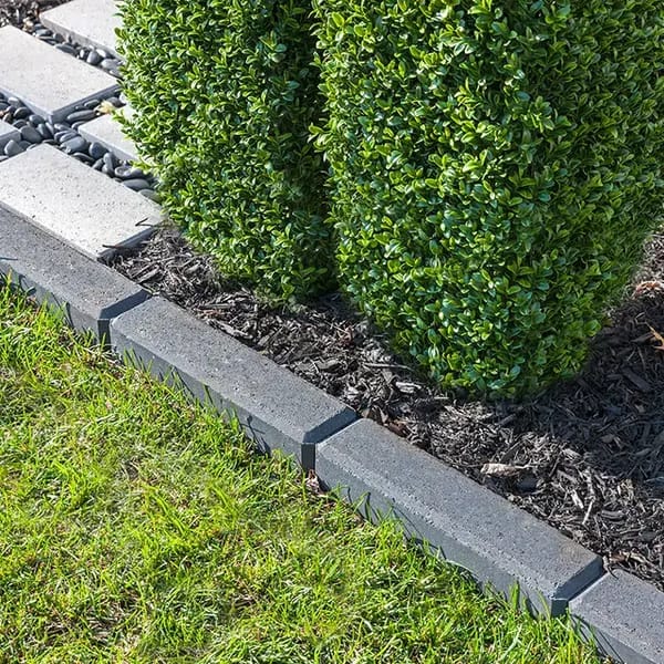 Raffinato Smooth by Techo-Bloc, modern smooth concrete edging stones, providing sleek and clean borders for garden beds and driveways.