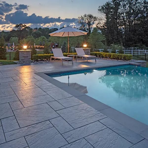 Aberdeen Slabs in a sleek, linear pattern, providing a smooth, modern patio surface with Klean-Bloc protection for long-lasting beauty.