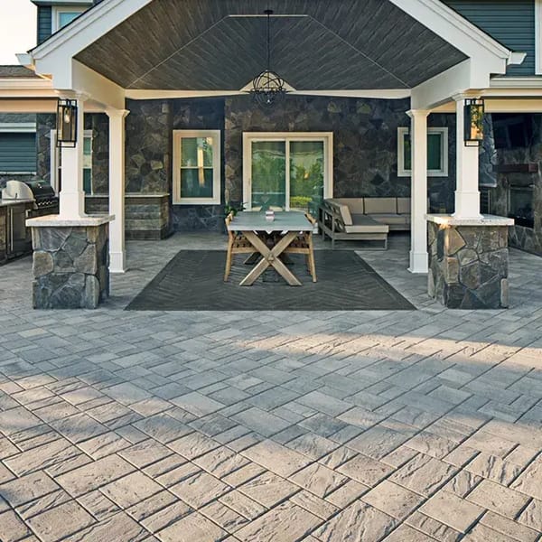 Eva Slate Pavers by Techo-Bloc with slate texture, creating a budget-friendly and stylish patio with a smooth, elegant finish.