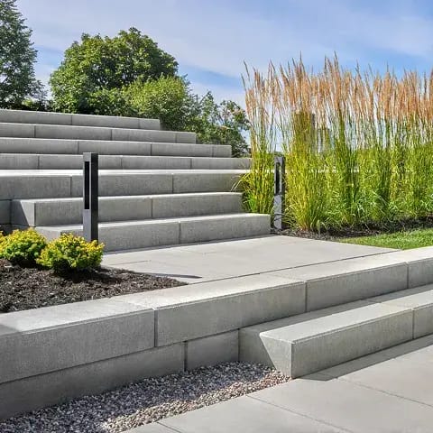 Raffinato Step by Techo-Bloc, modern concrete steps with sleek lines, providing a durable, stain-resistant surface for outdoor staircases.