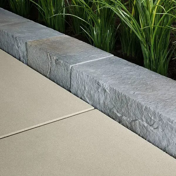 Rocka by Techo-Bloc, large natural stone imitation edging stones, perfect for creating structured borders around garden beds and walkways.